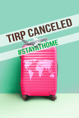Pink travel suitcase, Concept of Caneled trip to risk places COVID-19. crisis in tourism industry concept.