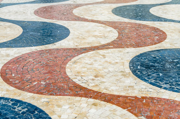 Colorful cobblestone pavement detail in Alicante, Spain