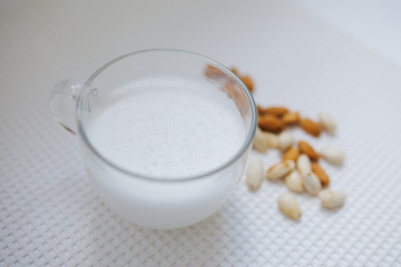 glass of milk on wooden table