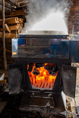 Spring - Boiling Maple Syrup over wood fire, Ontario, Canada