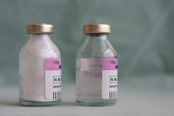Two vials of antibiotics, in the one is powder, in the second is diluted  solution.,  injection drugs used in treatment of  patients with pneumonia caused by coronavirus covid 19.