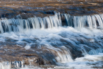Baird Creek waterfall in slow motion, on the Niagara Escarpment, close-up view.