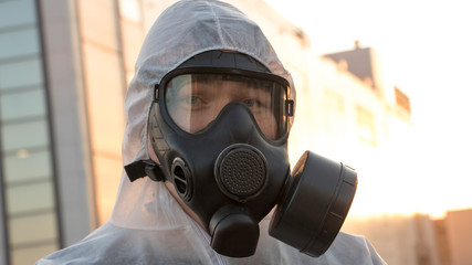 Man in respirator in biohazard zone