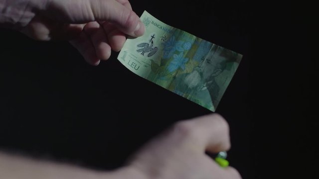Male hand burning dollar banknote. Man burning money cash. Financial crisis and depressed economy. Paper money loss concept. Fire money concept