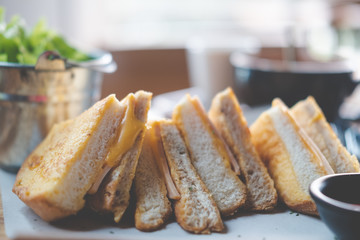 Triangle toast bread with ham and cheese.