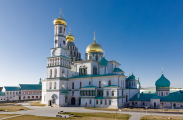Fototapeta na wymiar Temple of white stone with golden domes, the Cathedral of the New Jerusalem Monastery, Russia, Istra.