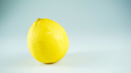 One lemon isolated on white background. Tropical fruit