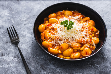 plant-based food, potato gnocchi with eggplant capsicum sauce and vegan cheese topping