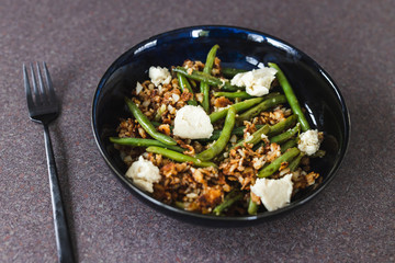 healthy plant-based food, crumbed hash brown with green beans and homemade vegan mozzarella made of cashews