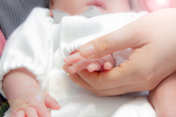 baby and mother's hands