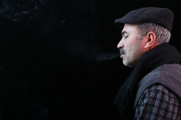 Studio shot of middle aged male fashion model and cigarette and health