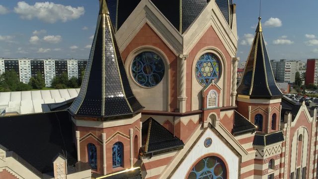 Flight close to liberal modern synagogue Kaliningrad historical facade decor details. Unique landmark. Dome stained glass. Faith, religion Judaism jews Russia. City center building. Summer aerial 4K