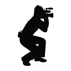 Man with movie video recorder in hand silhouette