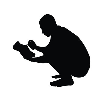 squatting man cleaning shoe silhouette clip art preview