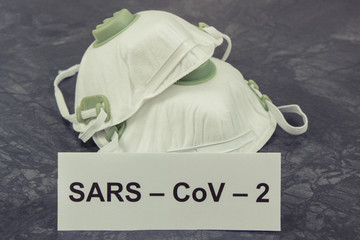 Inscription Sars-CoV-2 and protective mask N95. Stop spreading outbreak coronavirus. Covid-2019