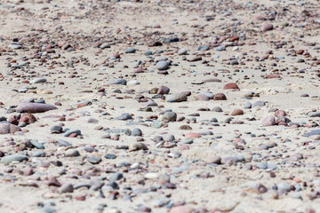 Colorful pebble on a sandy beach