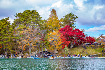 Obraz premium Urabandai lake, Japan : 2016 October 30. The most famous lake view in autumn. There are many peoples come to visit 5 lakes around with fall foliage scene.