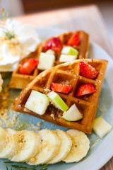 Waffle of fresh berries  strawberry, blueberry, bananas and chocolate topping,Sweet dessert cafe