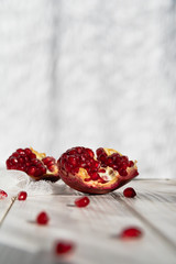 Pomegranate slice and seeds close-up. Selective focus. Space for text, copy space. Card.