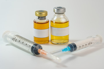 Vaccine bottle with blank label and syringe injection