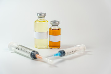 Vaccine bottle with blank label on white background