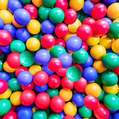 Fototapeta na wymiar Colored plastic balls in the kids pool playroom
