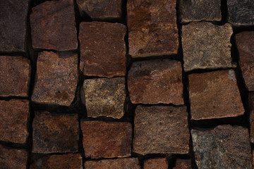 Top view on stone paving stones. Old sidewalk made of granite. Mock up or vintage grunge texture.