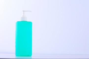 empty green bottle hand sanitizer on white background
