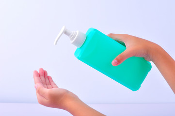 Man wash their hands with alcohol gel to prevent the spread of infections corona virus along with avoiding bacteria. Isolation on white background with clipping path.