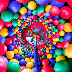 children's playroom with colorful balls and a slide made of plastic. . Tiny little planet 360