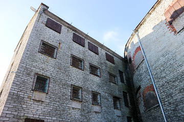 Brick walls and barred windows of Sea Fortress Patarei abandoned former soviet prison in Tallinn Estonia