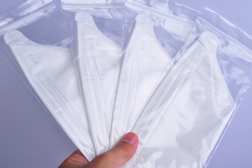 Hand hold N95 mask on a white background, Concept of covid-19