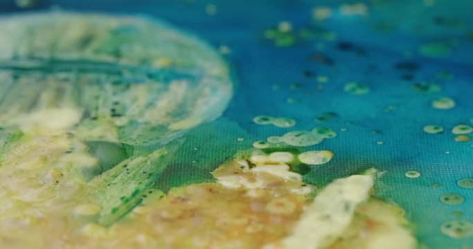 artist's work with wax in the technique of hot batik close up