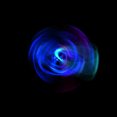 Spinning rays of light isolated on black background. Graphic 2D illustration of glowing colorful light particles in circular motion.