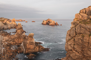 Incredible cliffs on the coast near the village of Liencres before sunrise. Cantabria. Northern coast of Spain