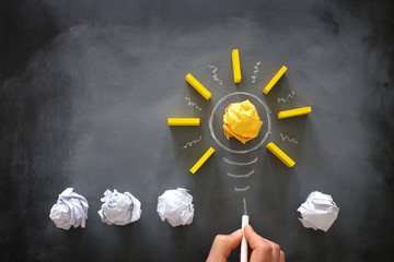 Education concept image. Creative idea and innovation. Crumpled paper as light bulb metaphor over...
