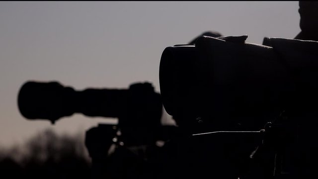 Bird watchers in silhouette twitchers and birders UK 4K