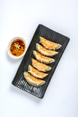 gyoza or dumplings snack with soy sauce on white isolated