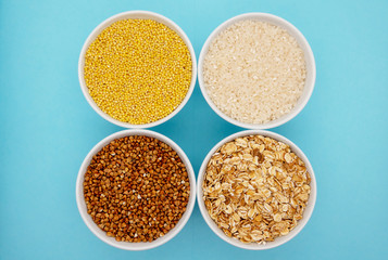 Twig red millet, yellow millet twig. Buckwheat, millet, rice and wheat on blue