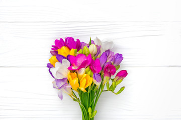 Bouquet of sprig freesia flowers isolated on white background Floral holiday card Top view Flat lay