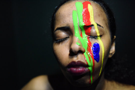 oil Painting colors smudges drips from African  woman face