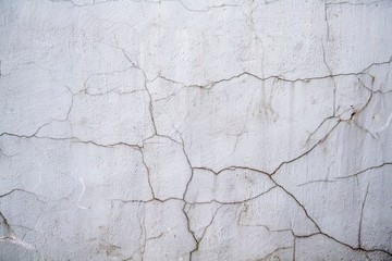 Cracked stucco on the wall