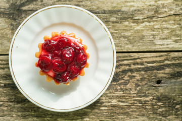 cherry pie on a white saucer. high-calorie sweet food