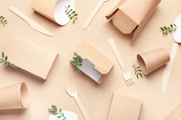 Eco containers for food and drinks on color background