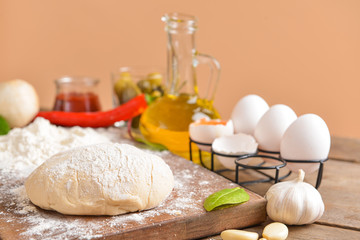 Ingredients for tasty pizza on table