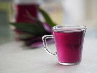 Herbal juice in clear glass droplets along the edge Tradescantia spathacea