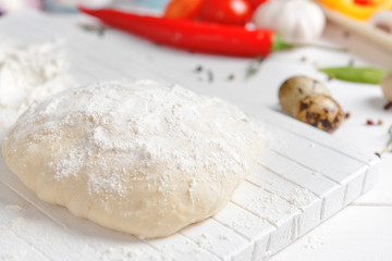 Dough for tasty pizza on table