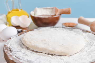 Dough for tasty pizza on table