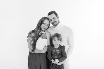 concept of healthy lifestyle, protection of children, shopping - baby in the arms of the mother and father. Woman and man holding a child. Isolated on white background. Copy space. Portrait of faamily