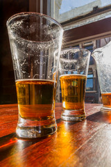 Glasses of light beer on the table